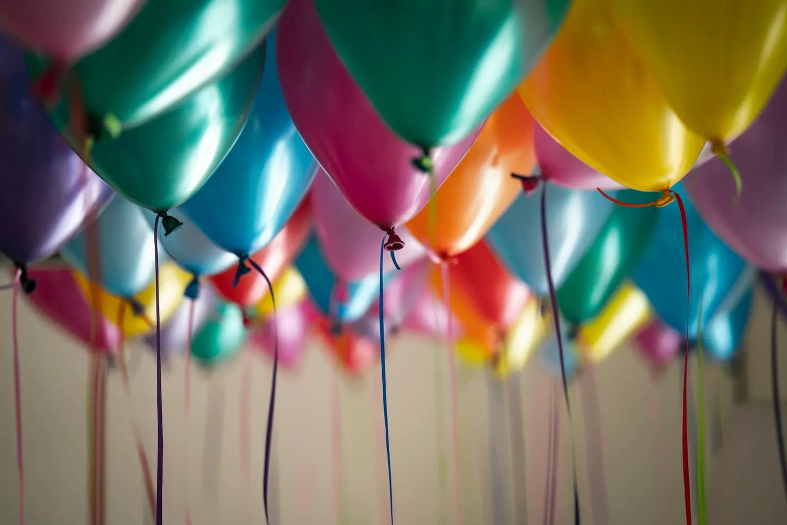 Balloons floating over a party